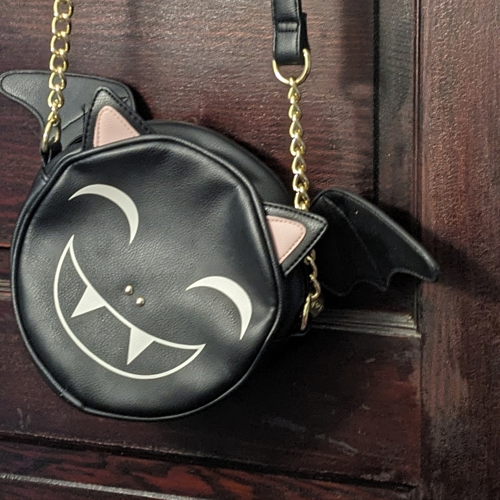 Betsy Johnson bat crossbody bag